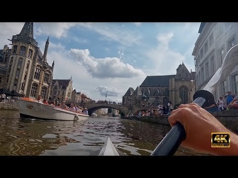 グラーベンスティーン城へのカヤック：ゲントの活気ある歴史的中心部の夏の雰囲気（4K ビデオ）