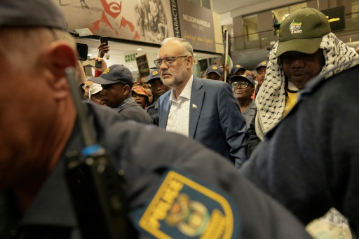 Expelled S.Africa envoy to US back home 'with no regrets'