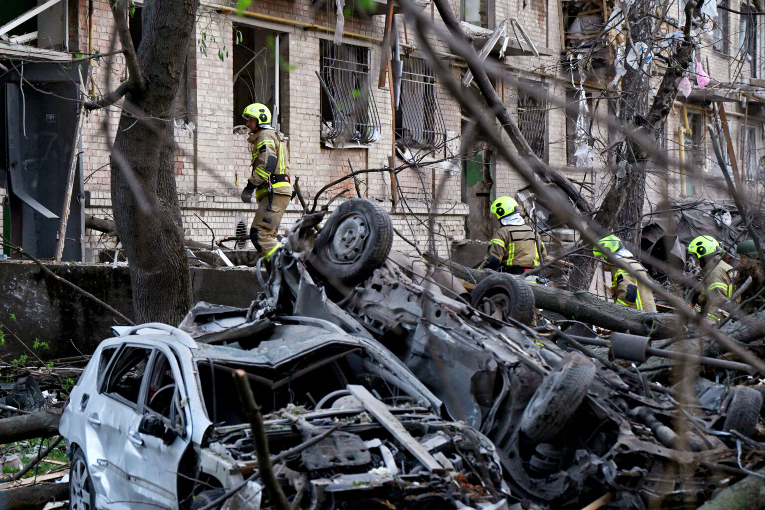 Emergency services at the site of a Russian missile attack in Kyiv on April 24.