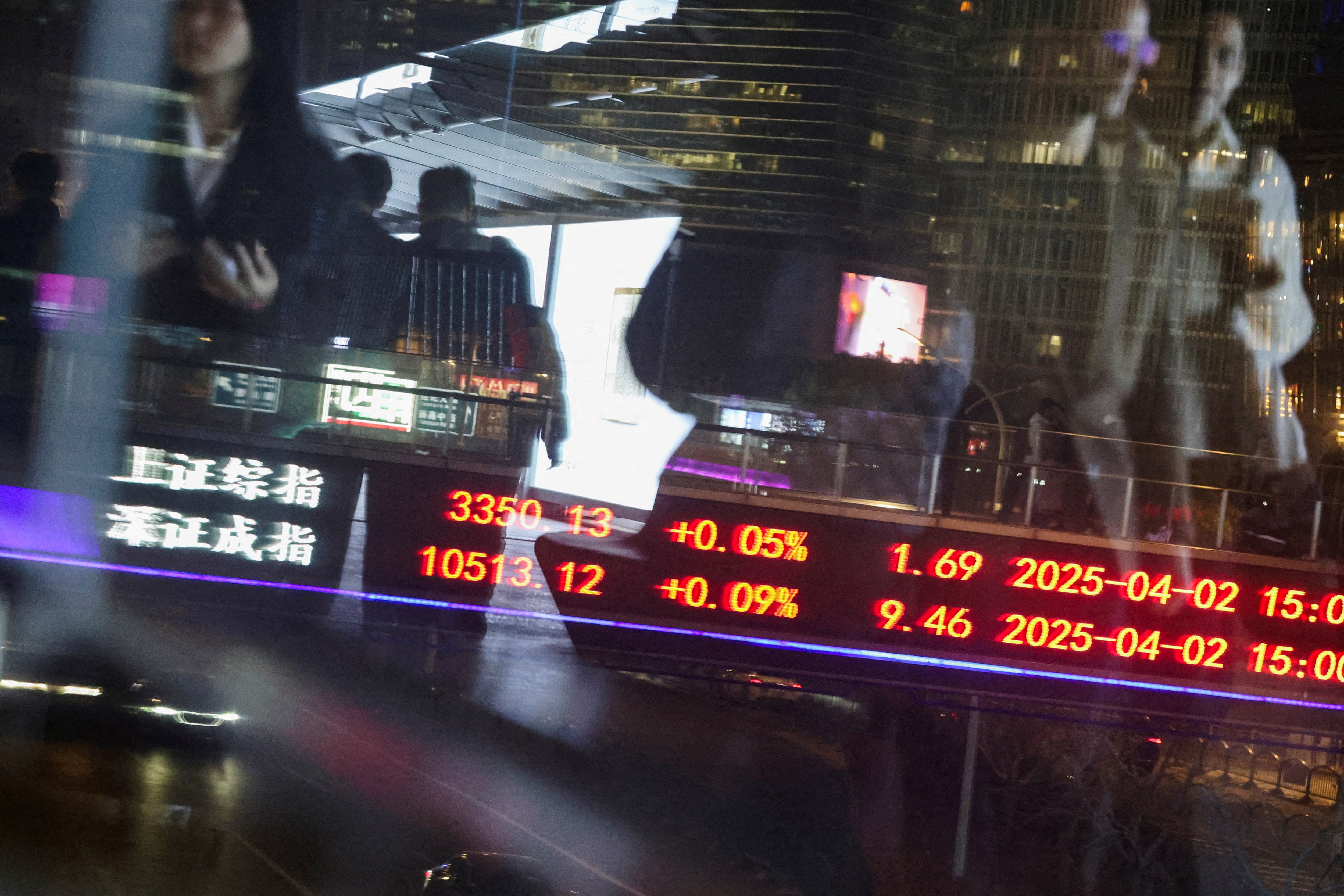 Electronic board shows stock indices in Shanghai