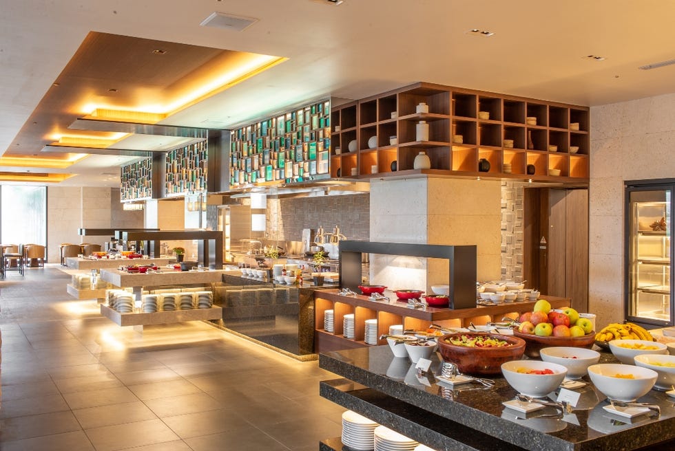 buffet area with a variety of food options in a modern restaurant