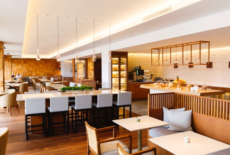modern cafe interior with seating and a buffet area