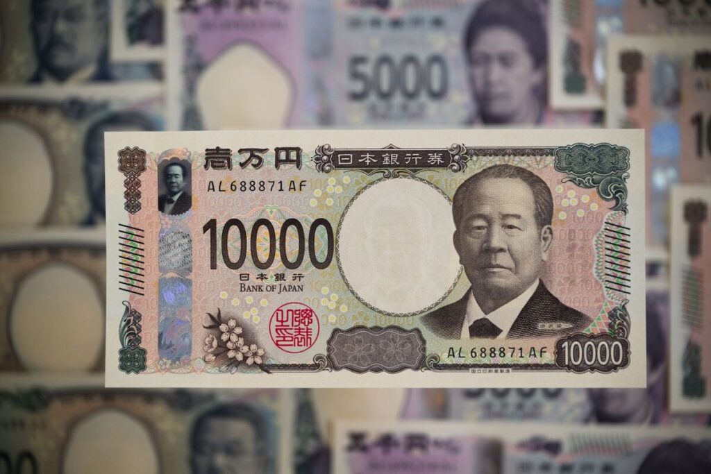 選挙後の円一段安警戒、与党過半割れで150円突破も－財政拡大不可避 - Bloomberg