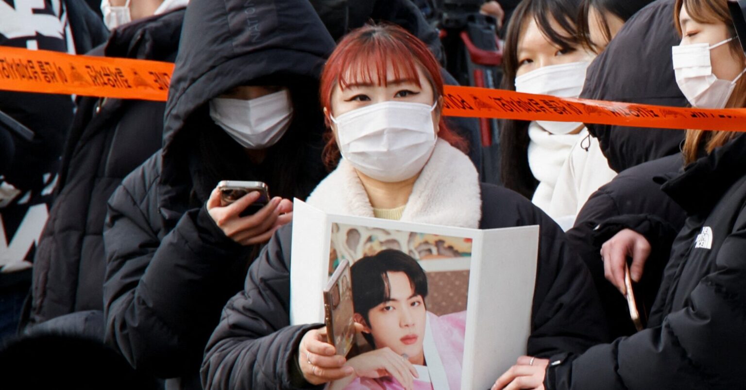 BTS star Jin begins South Korea army duty amid tight security, cheering fans