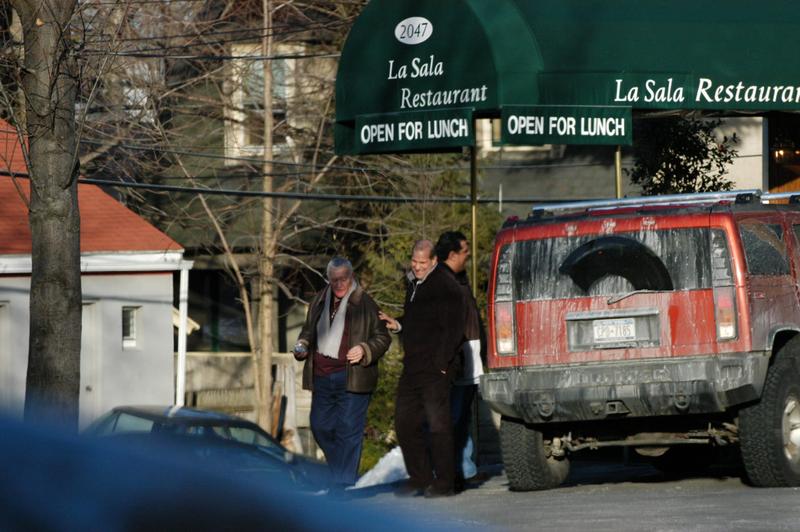 Distant photo of three guys outside of the La Sala Restaurant.