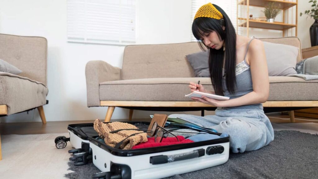 Woman and suitcase for travel summertime vacation packing clothing. relax and getaway preparation