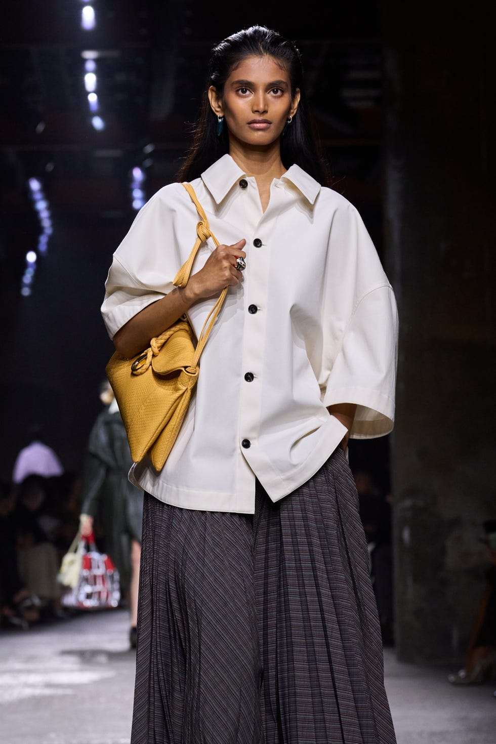 model showcasing a fashion outfit on the runway