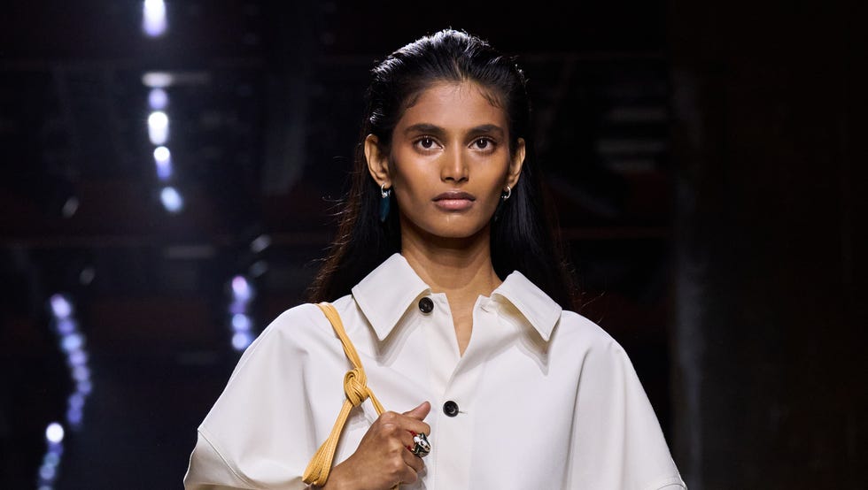 model showcasing a fashion outfit on the runway