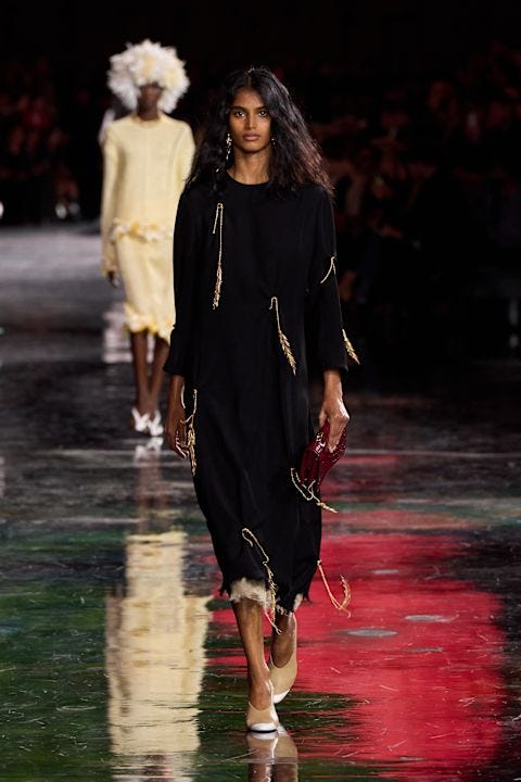 fashion runway presentation featuring diverse models