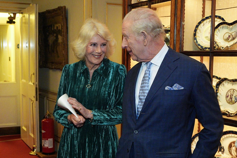 BRITAIN-ROYALS-LITERATURE britains king charles iii (r) and britains queen camilla attend a reception to host the first recipients of the reading room medals, at clarence house in london on march 25, 2026. the reading room medals are for those who have promoted books and literature in communities across the united kingdom. (photo by aaron chown / pool / afp via getty images)