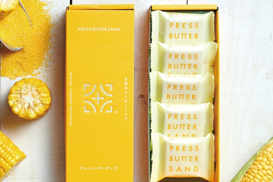 『大北海道展』に登場する「PRESS BUTTER SAND」のバターサンド 北海道れん乳とうきび（1箱5個入1377円）。4月15日～29日まで出店。「新千歳空港」限定