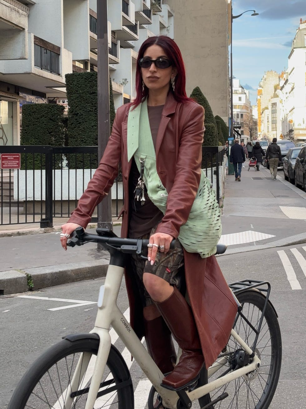 individual riding a bicycle in an urban setting