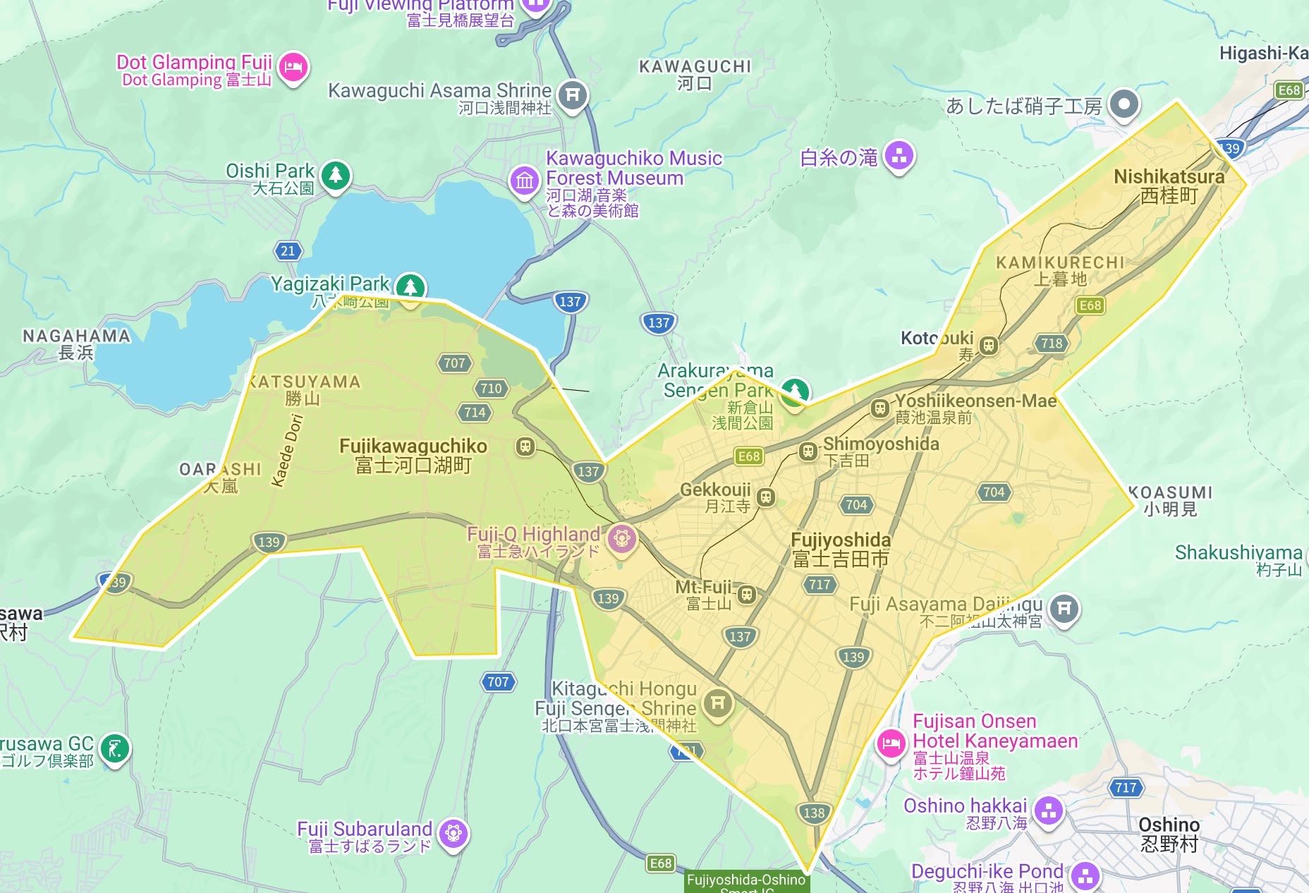 Map highlighting the area around Fujikawaguchiko, Fuji-Q Highland, and Fujiyoshida in Yamanashi Prefecture, Japan, with notable landmarks such as Lake Kawaguchi, Oishi Park, Yagizaki Park, and several shrines and parks labeled. The highlighted region is bordered by major roads and includes towns like Nishikatsura and Katsuyama.