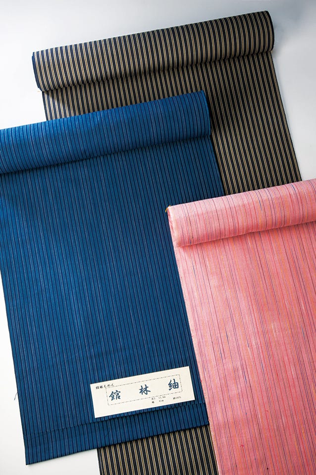 three rolls of fabric in various colors and patterns　館林木綿