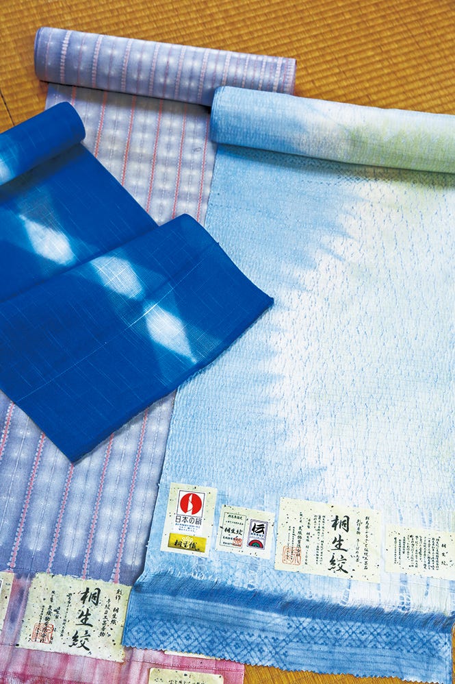 collection of fabric rolls featuring various patterns and colors