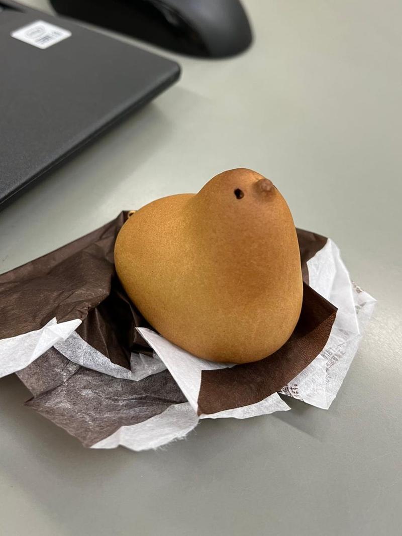 An unwrapped cake in the shape of a bird