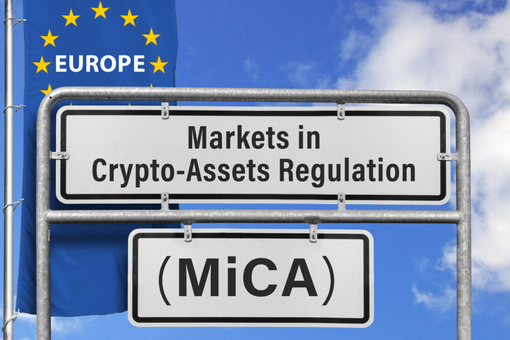 Markets in Crypto-Assets Regulation (MiCA), Europe-Flag, (symbolic image) | NADA NEWS(ナダ・ニュース) EU flag with stars and a road sign reading'Markets in Crypto-Assets Regulation (MiCA)'.,